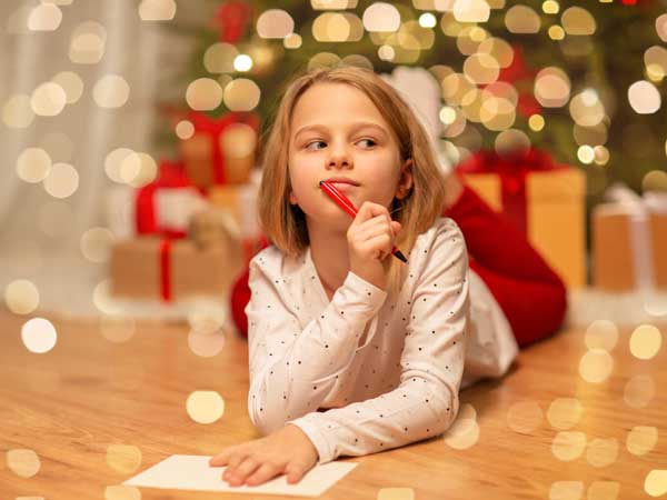 Girl writing a letter to santa