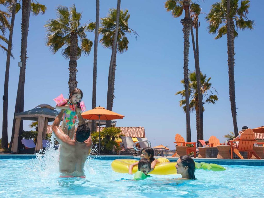 Family in the pool at Mission Bay Resort.