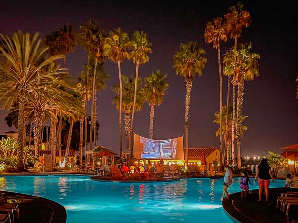 Mission bay pool with a movie playing.