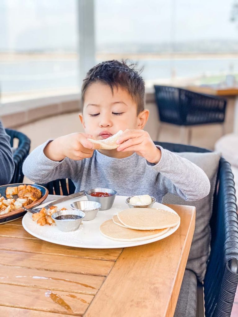 Kid Eating Pancakes.