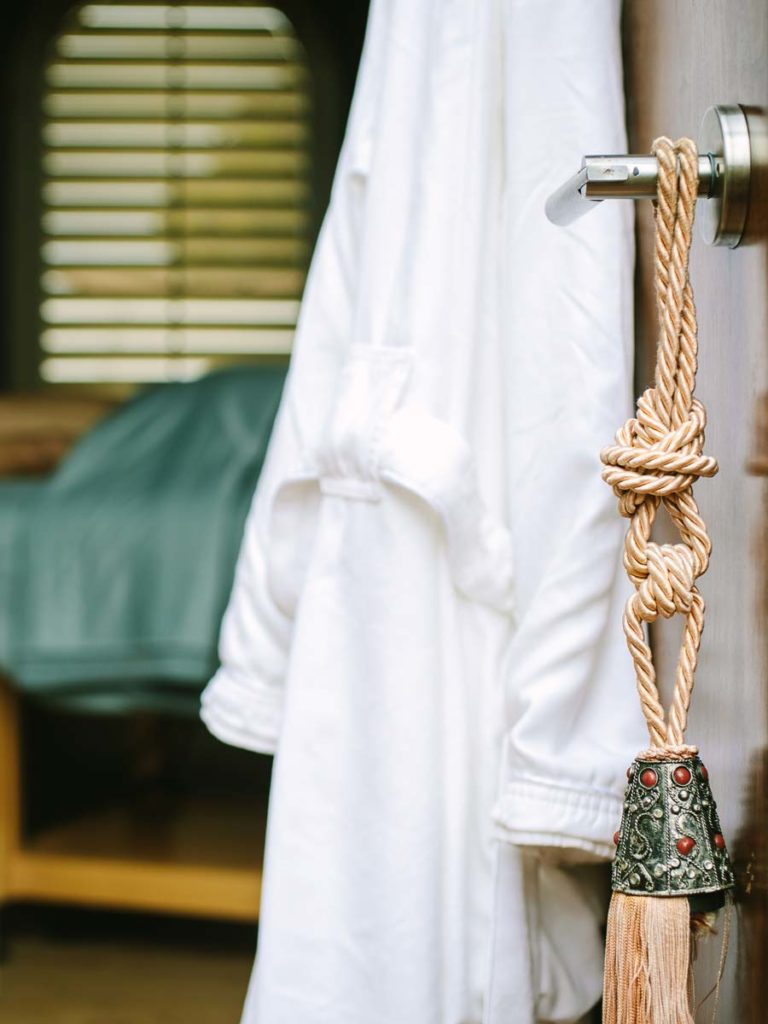 Spa Robe Hanging On The Door.