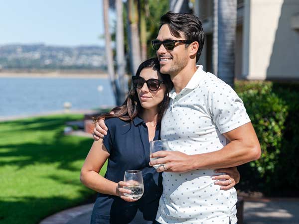 Couple Posing Outside With Wine
