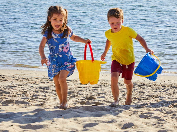 Kids Playing On The Beach
