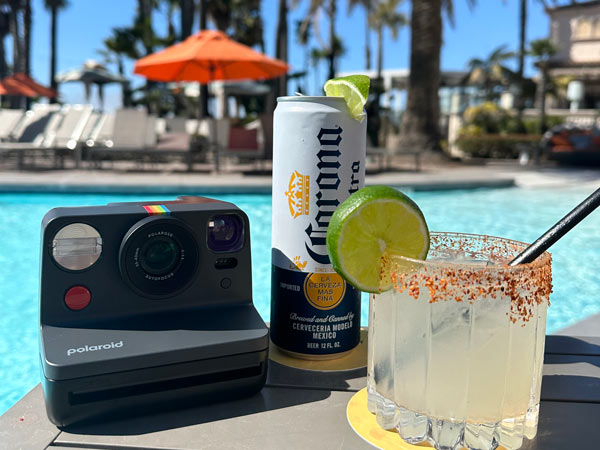 Polaroid Camera And Drinks By The Pool