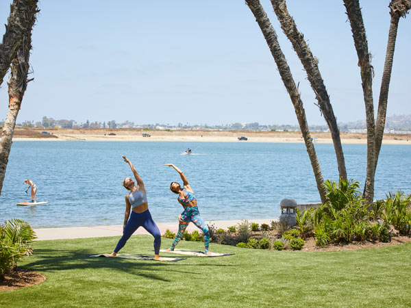 Ladies Doing Yoga By The Ocean