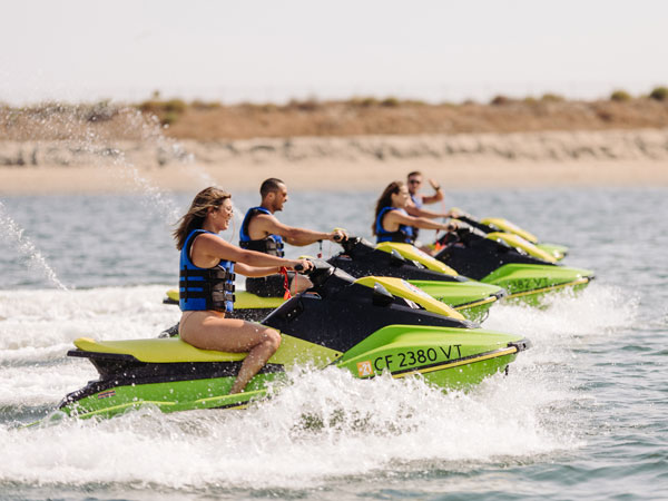 Friends Riding Jet Skis In San Diego