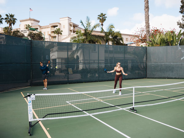 People Playing Pickleball On A Court