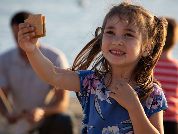 Little Girl Eating A Smore