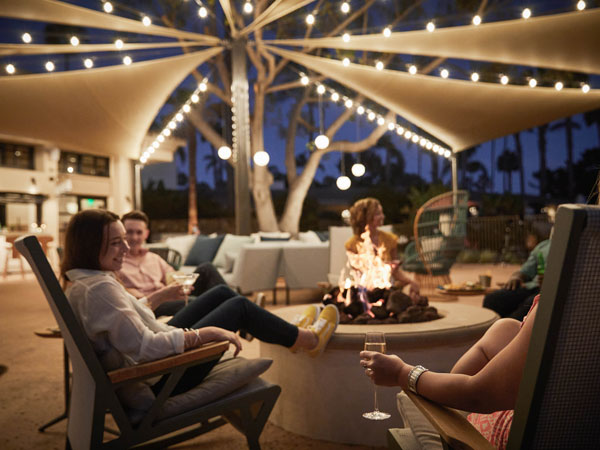 Friends Sitting Around A Firepit