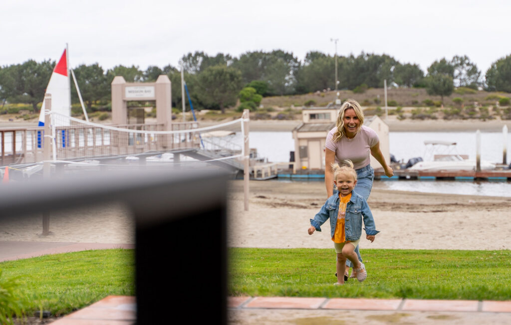 Mom And Daughter Playing At The Park