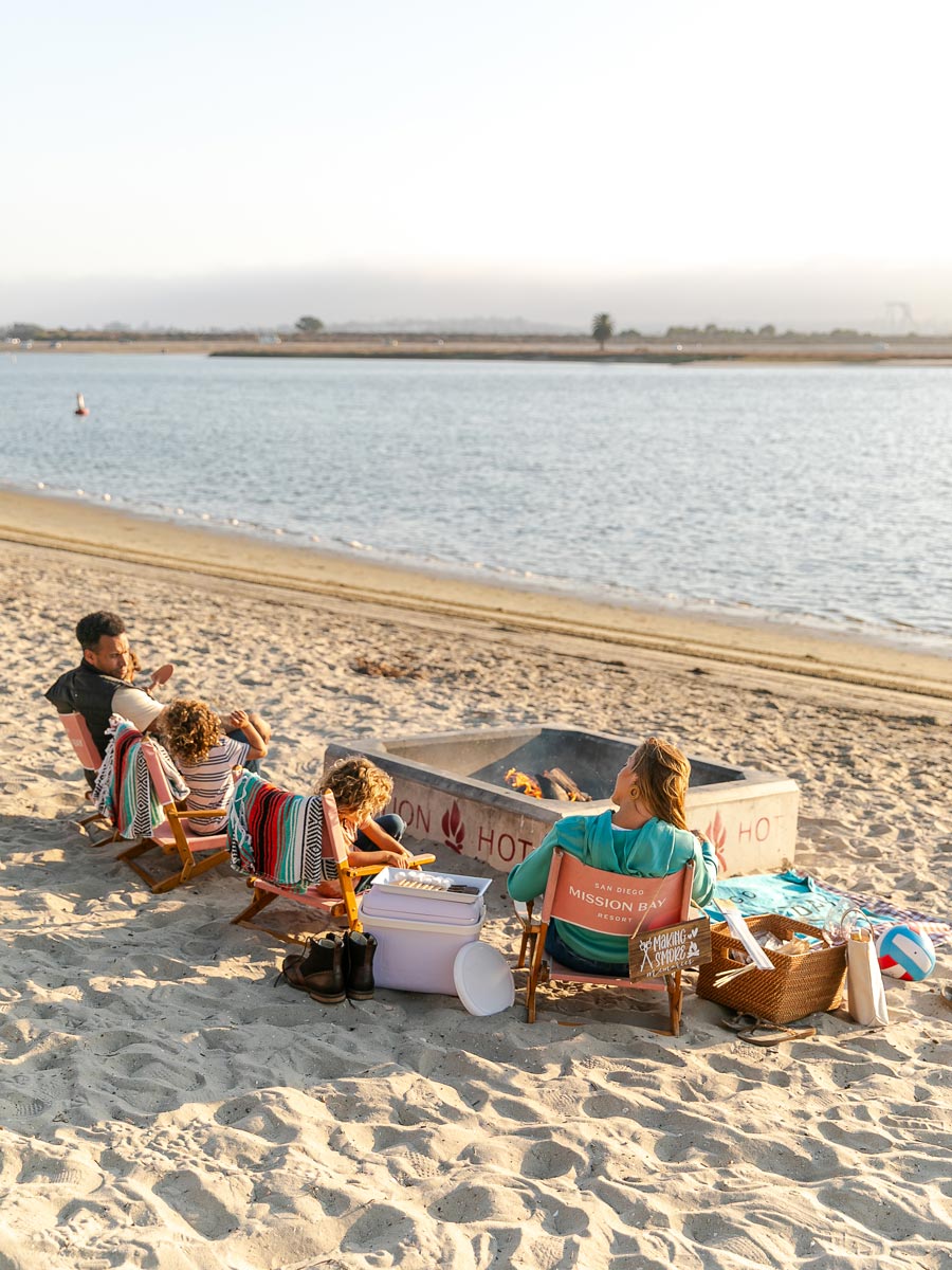 Family Making Smores On The Beach