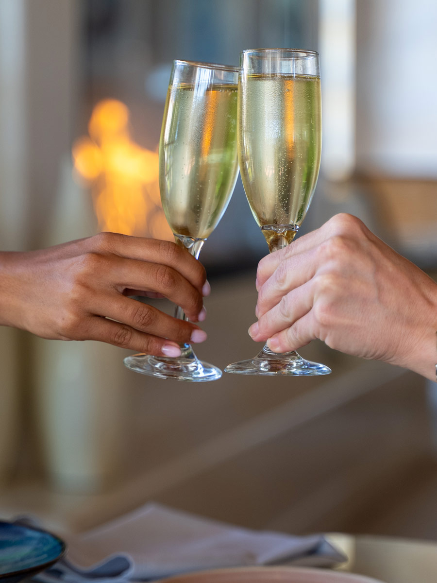 couple cheering with champagne glasses