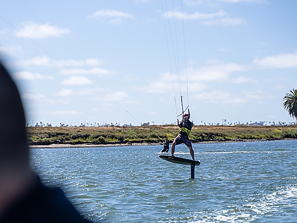 Guest enjoying kiteboarding on the calm waters of Mission Bay, San Diego