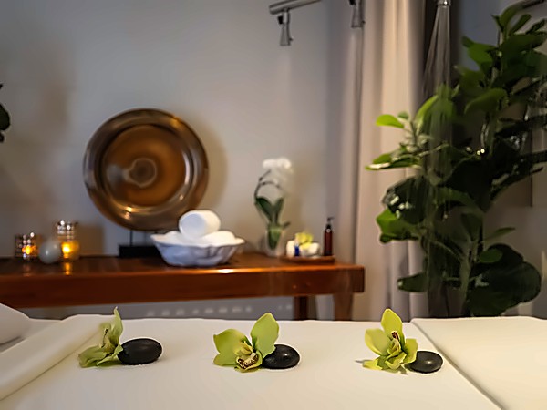 Orchid and hot stone spa table setup at San Diego Mission Bay Resort.