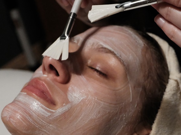 Facial mask applied with fan brushes at San Diego Mission Bay Resort spa